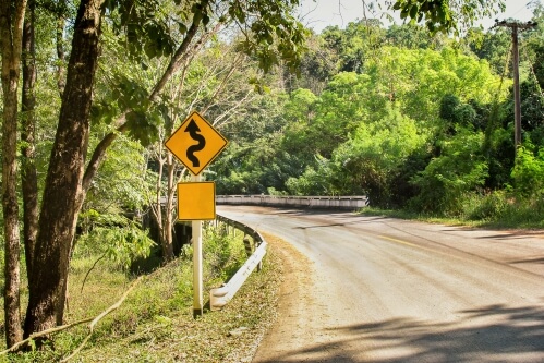 windy road sign